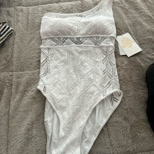 BECCA NWT one piece swimsuit. One shoulder with strappy back